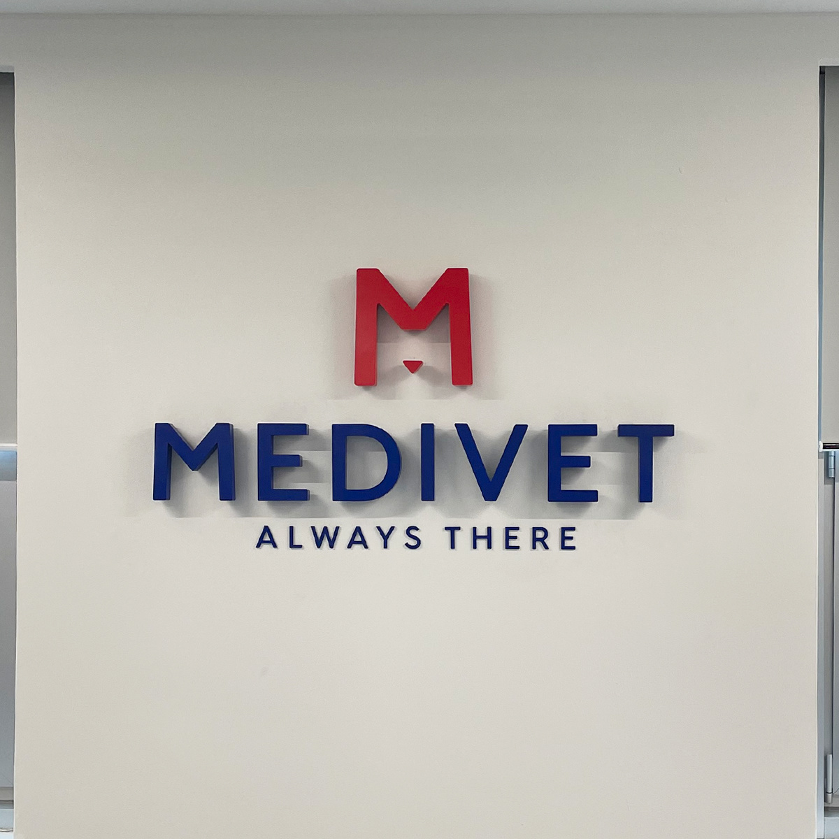 Built-up metal Medivet logo fixed to internal wall