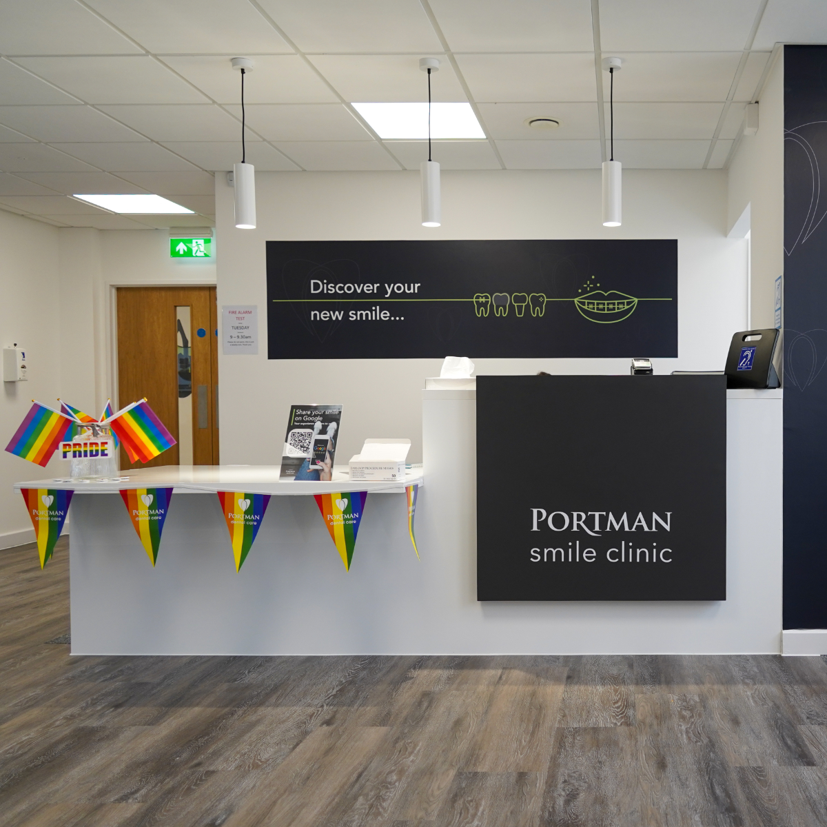 Portman Smile Clinic Ilkley reception area featuring Portman Dental wall and desk branding